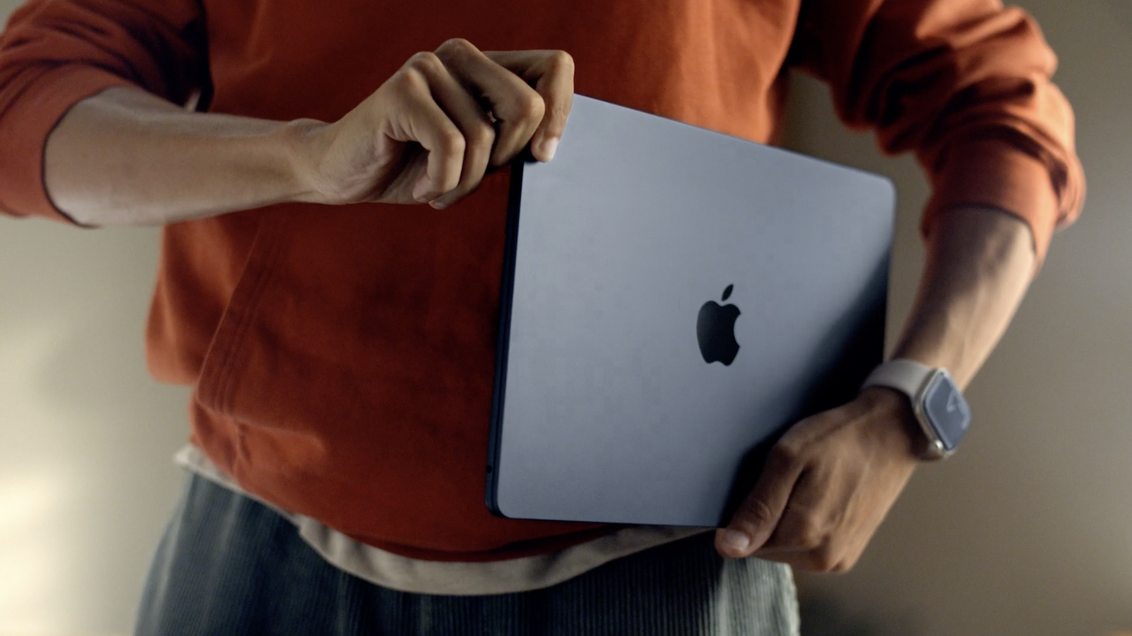 Man carrying MacBook Air